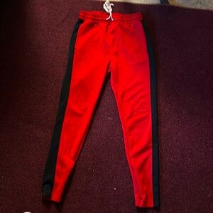 worn joggers with zippers by the feet